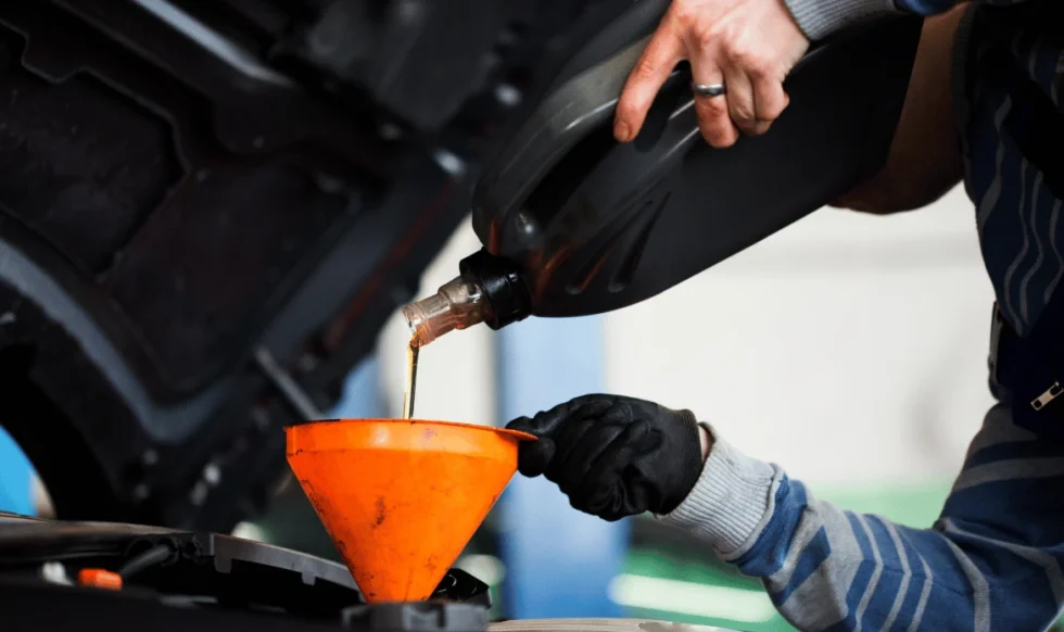 oil change on diesel truck in Edmonton Mechanic performing oil change on diesel truck in Edmonton