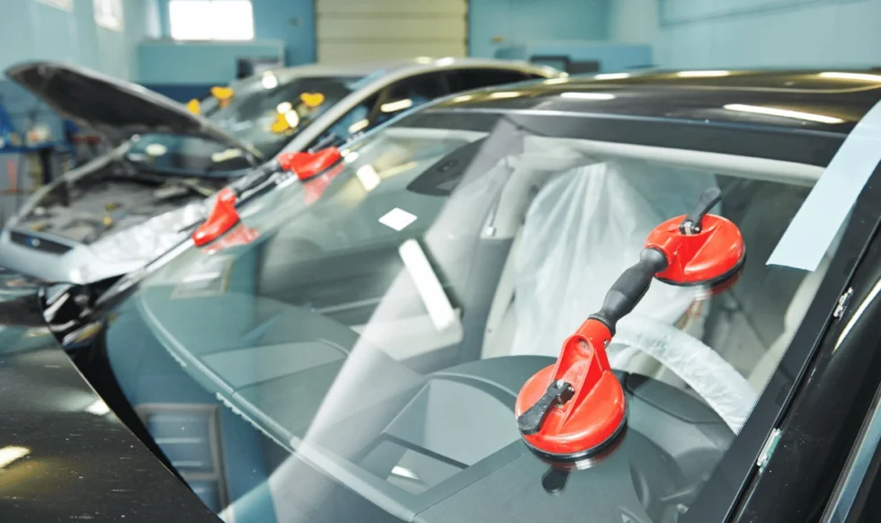 windshield in Edmonton Technician replacing cracked windshield in Edmonton