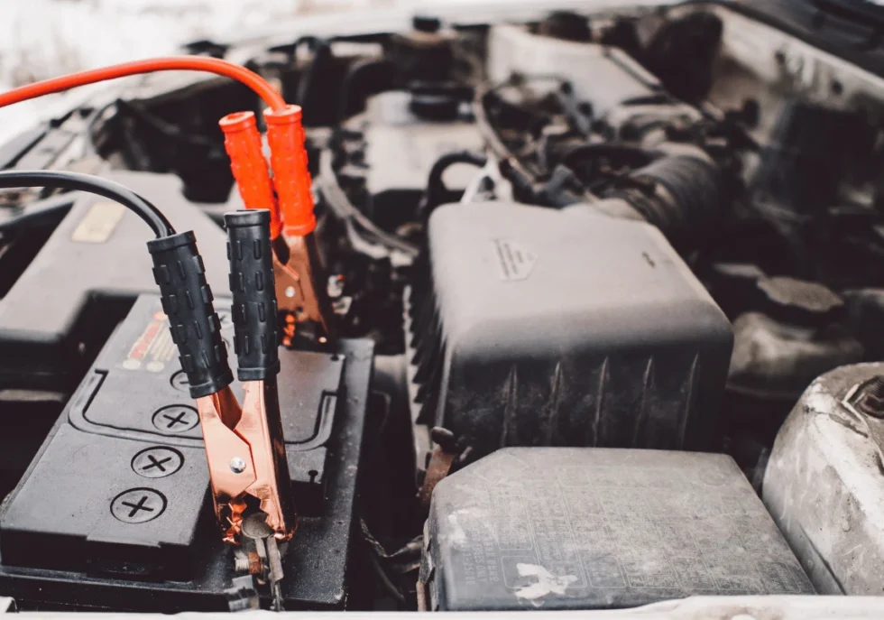 Technician testing a car battery with diagnostic tool in Edmonton